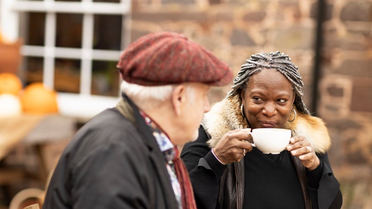 Visitors relaxing outside with refreshments